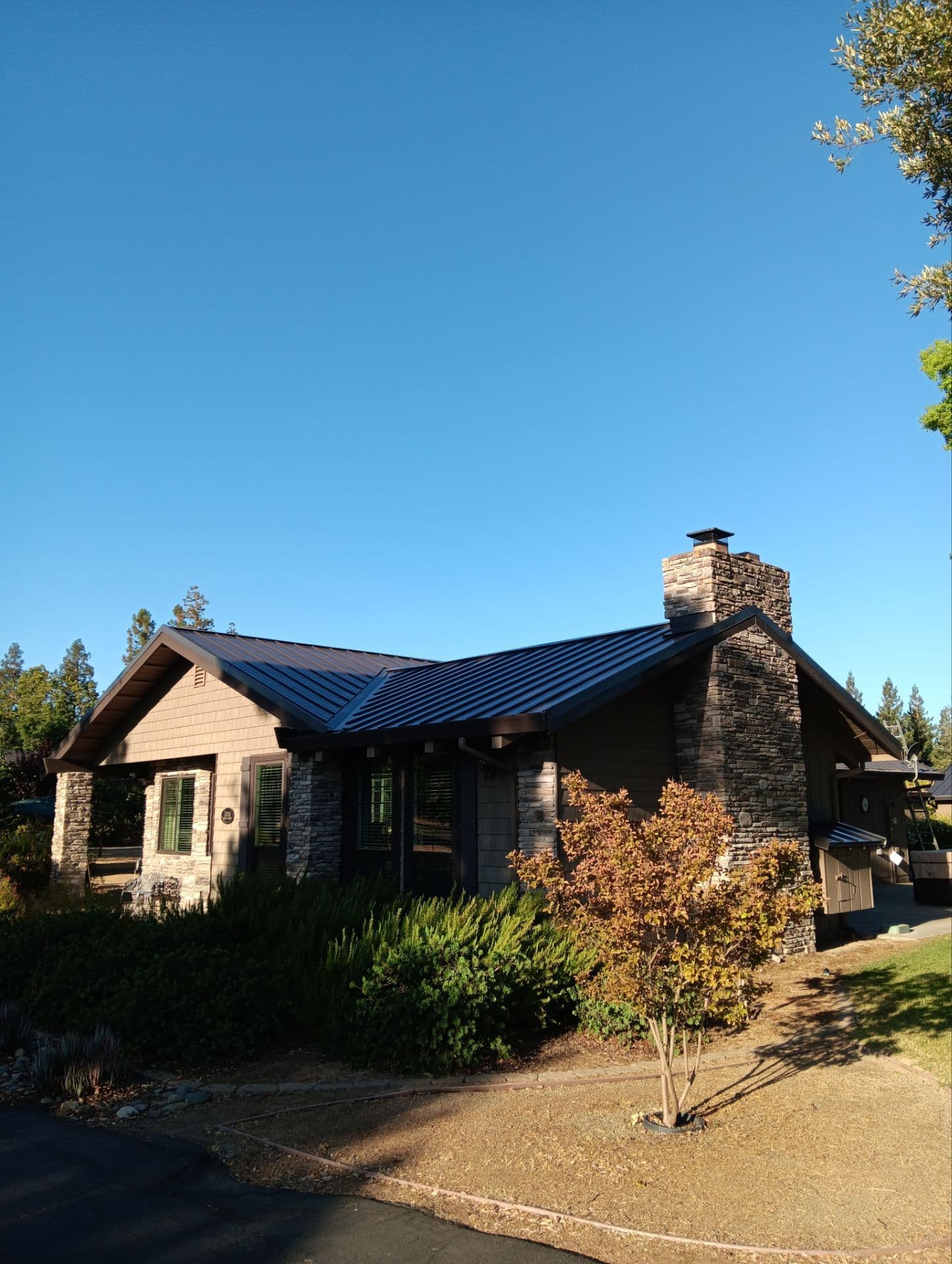 Completed standing-seam metal roof installed by Two Rivers Roofing