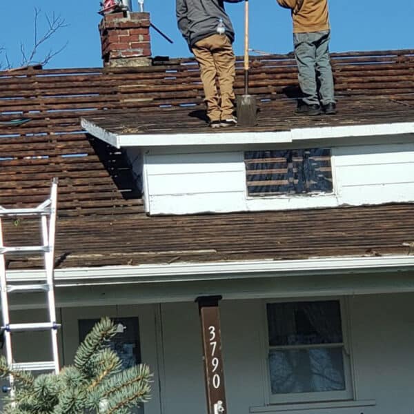Emergency roof leak repair in progress by Two Rivers Roofing on a Sacramento home